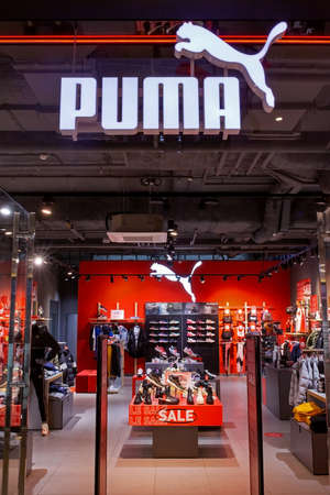 Puma brand shop for sporting goods. Clothes, footwear, equipment and accessories for sports and active lifestyles. German sports brand. Minsk, Belarus - February, 2022のeditorial素材