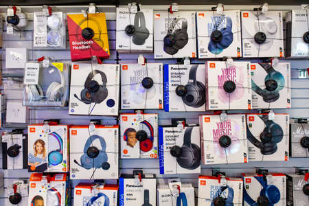 Various Headphones of different brands for sale at electronics store. Minsk, Belarus - February, 2022のeditorial素材
