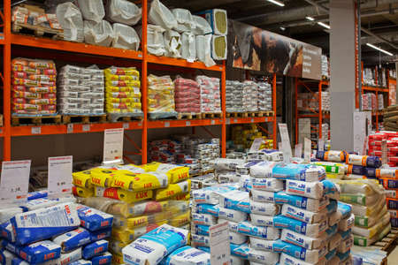 Large selection of building materials are sold in a hardware store. Warehouse for wholesale and retail trade in building materials. Goods for construction and repair. Minsk, Belarus - april, 2022のeditorial素材
