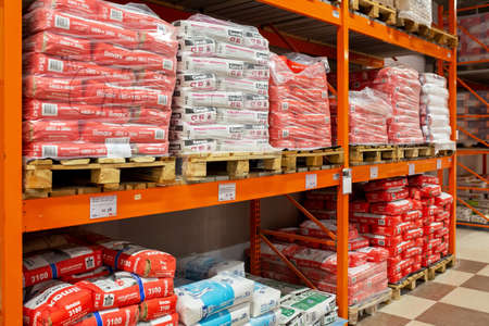 Large selection of building materials are sold in a hardware store. Warehouse for wholesale and retail trade in building materials. Goods for construction and repair. Minsk, Belarus - april, 2022のeditorial素材