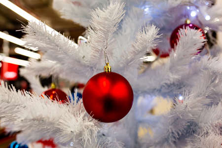 Red Christmas ball decorated Christmas tree. Christmas time. New year eve. Winter holidays.の写真素材