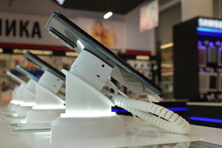 Smartphones are sold in an electronics store.