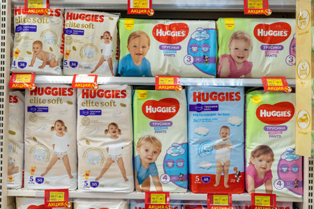 Huggies baby diapers displayed on the shelves in a supermarket. Huggies is the brand name of a...