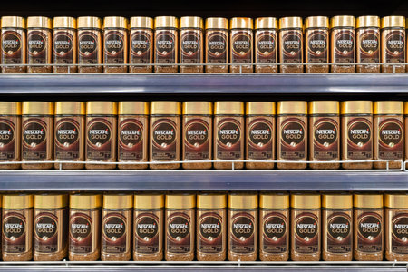 Nescafe Gold coffee on store shelf. Nescafe instant coffee. Nescafe is a brand of instant coffee made by Nestle. Minsk, Belarus, 2022のeditorial素材