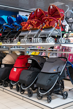 Row of baby strollers in children's store, nobody. Minsk, Belarus, 2022