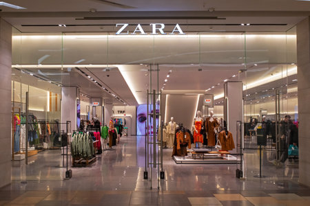 Zara fashion store in shopping center. Brand logo and view inside the store. Minsk, Belarus, 2022のeditorial素材