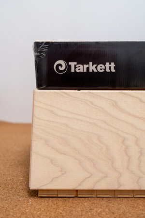 Ash parquet board next to new packs of Tarkett parquet. Minsk, Belarus, 2022のeditorial素材