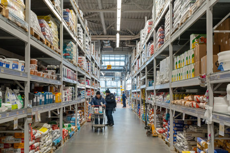 Large store selling building materials. Buyers choose goods for repair. Minsk, Belarus, 2022のeditorial素材