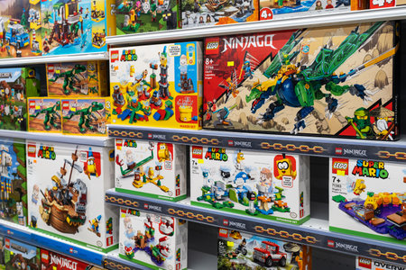 Lego construction kits for sale in supermarket. Lego is a line of plastic construction toys that are manufactured by The Lego Group company in Denmark. Minsk, Belarus, 2023のeditorial素材