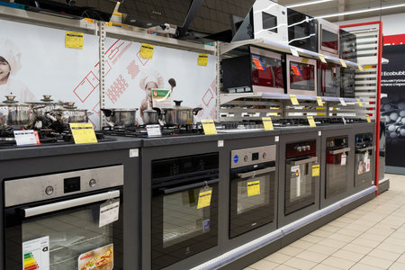 Gas and electric ovens, stoves and other appliance or equipment in the retail store showroom. Minsk, Belarus, 2023のeditorial素材