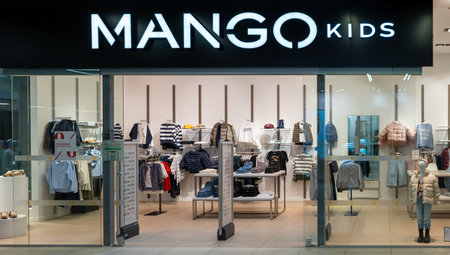 MANGO KIDS clothing store in shopping center. Logo and view inside the store. Minsk, Belarus, 2023