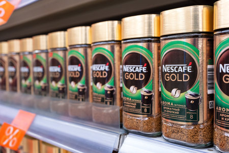 Nescafe Gold coffee on store shelf. Nescafe instant coffee. Nescafe is a brand of instant coffee made by Nestle. Minsk, Belarus, 2023のeditorial素材
