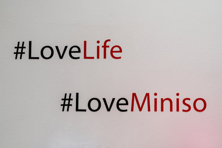 Interior of Miniso brand store. The inscription on the wall in the interior of the Miniso store - #LoveLife, #LoveMiniso. Minsk, Belarus, 2023のeditorial素材