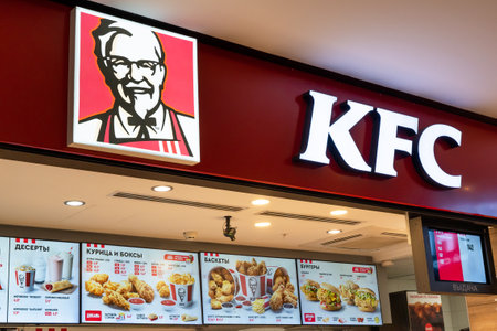 KFC Fast Food Restaurant. Kentucky Fried Chicken Restaurant Sign and Fast Food show menu for customer. Minsk, Belarus, May 18, 2023のeditorial素材