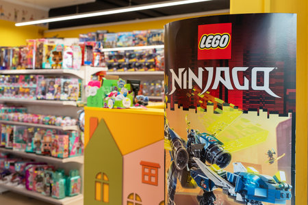 Lego company advertising at the entrance to a toy store. Lego company logo on a promotional post....