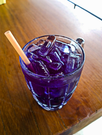 black currant with juice and green leafの写真素材