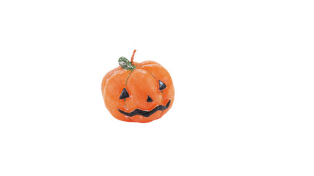 Scary Jack O'Lantern halloween pumpkin with candleの写真素材
