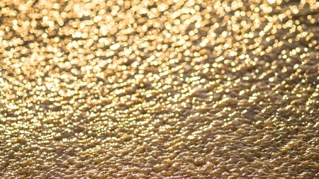 Bokeh golden lights on background (gold, sand)の写真素材