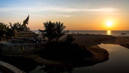 Sunset naka statue Karon beach Phuketの写真素材