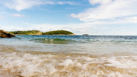 AoSaneBeach is a small bay next to Nai Harn right. Through the Phuket Yacht Club. A quiet little beach with rocky and sandy beaches the beautiful very clean PhuketThailandの写真素材