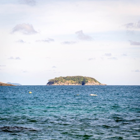 AoSaneBeach is a small bay next to Nai Harn right. Through the Phuket Yacht Club. A quiet little beach with rocky and sandy beaches the beautiful very clean PhuketThailandの写真素材