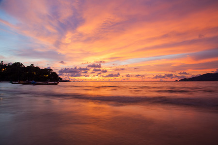 Sunset at the Patong beach, Phuket, Thailandの写真素材