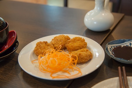 Fried shrimp meat ball with sauceの写真素材