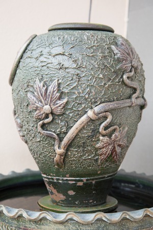 A closeup of a vase sculpture garden decorの写真素材