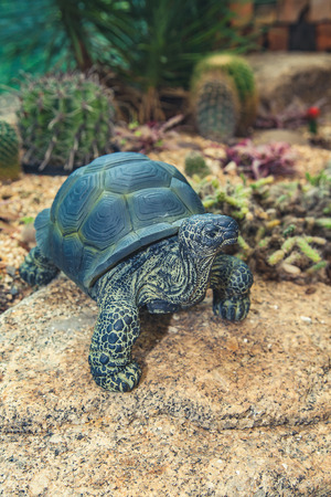 A stone Turtle as decoration in the garden