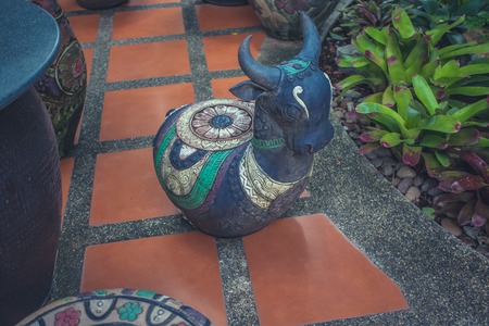 Stone sculpted of bull in the gardenの写真素材