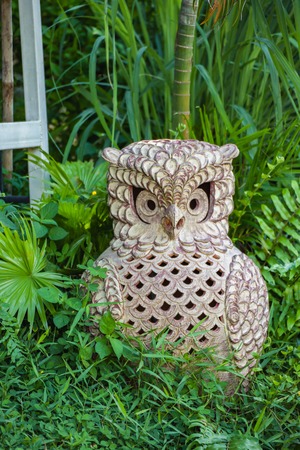 Owl ornament in the gardenの写真素材