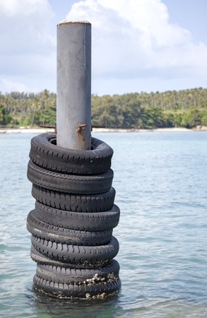 Collection of old tires, used as a bumper on a boat. Rawai, Phuketの写真素材