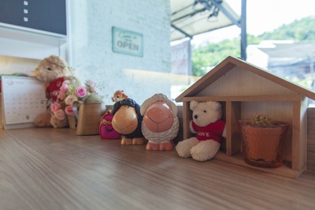 Dolly the sheep on wooden tableの写真素材
