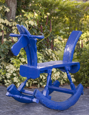 Children toy of blue wooden rocking horse chairの写真素材