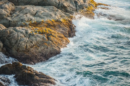 Sea waves crashing against the rocks,Phromthep Cape south of Phuket