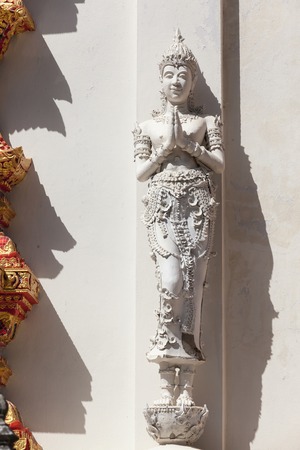 Thailand Angel sculpture on wall at thai templeの写真素材