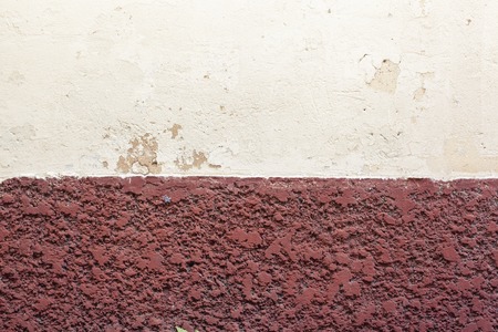 white and brown plaster wall for background or textureの写真素材