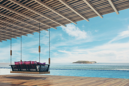 Beautiful swing sofa furnish and pillow for decoration and relax at balcony and pool sea view ,Vintage Tone - 3d renderingの写真素材
