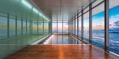 Sea view indoor swimming pool of a modern house at sunset,3d renderingの写真素材
