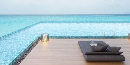 Beautiful view of Swimming Pool with  the sea at sunlight  - 3d renderingの写真素材