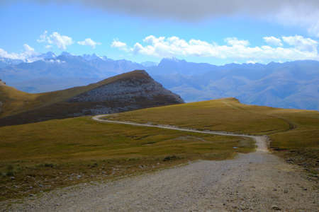 Mountain peak goes into the sky and cloudsの写真素材