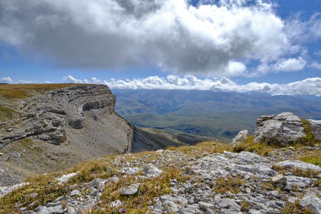 Mountain peak goes into the sky and cloudsの写真素材