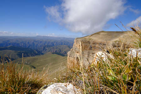 Mountain peak goes into the sky and cloudsの写真素材