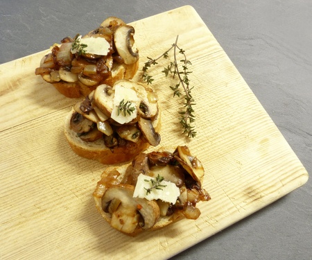 On bruschetta served on a wooden board の写真素材