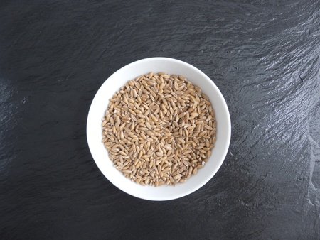 Spelt in bowl on slate 