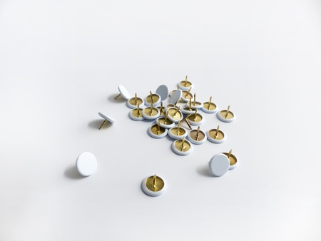 Many tacks against white background の写真素材