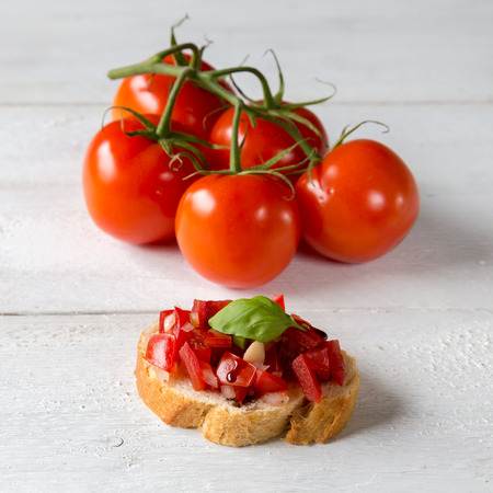 
Bruschetta with tomatoes on a wooden boardの写真素材
