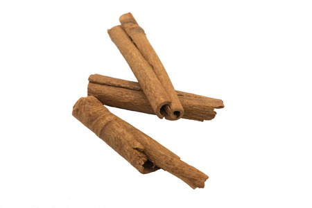 Cinnamon sticks macro isolated as Cut.