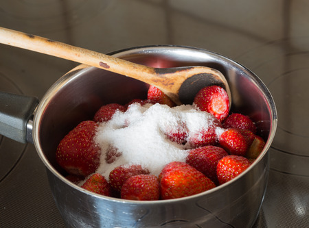 Strawberry jam cooking encore of sugar.の写真素材