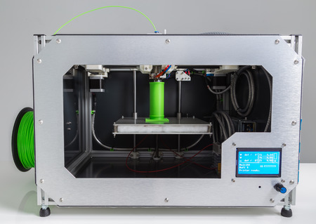 3d printer with bright green filament.の写真素材